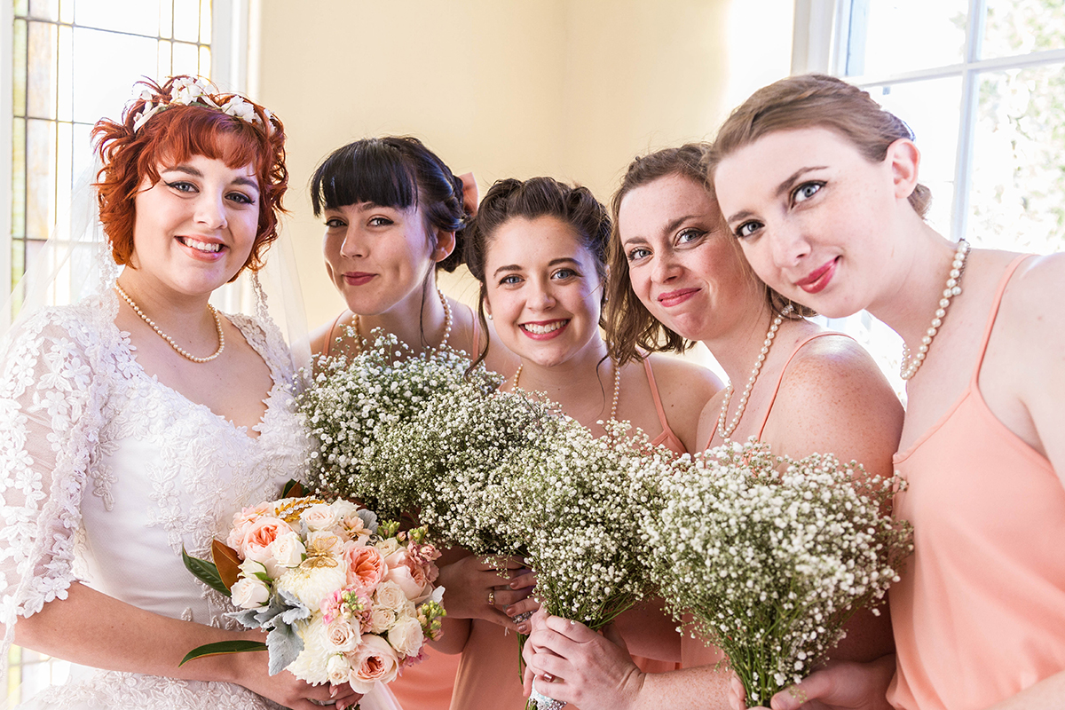 Vintage Bride and her beautiful bridesmaids holding bouquets.jpg