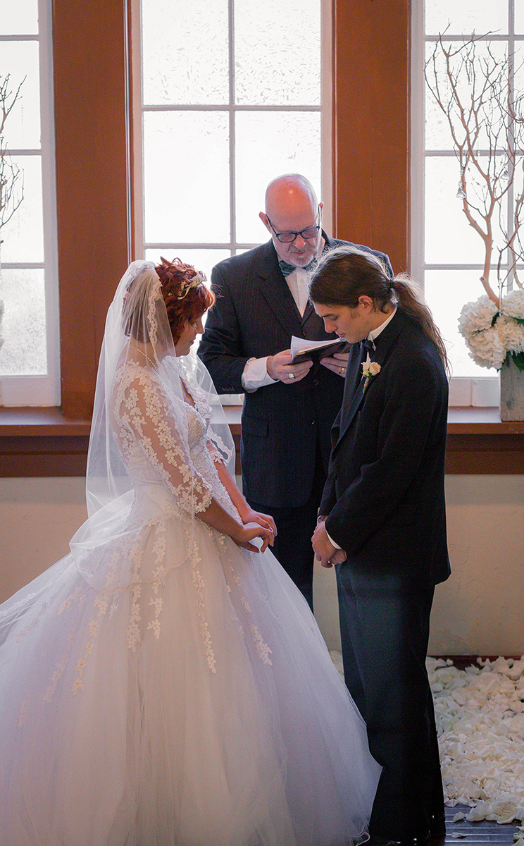 Vintage Bride and Groom during the prayer.jpg