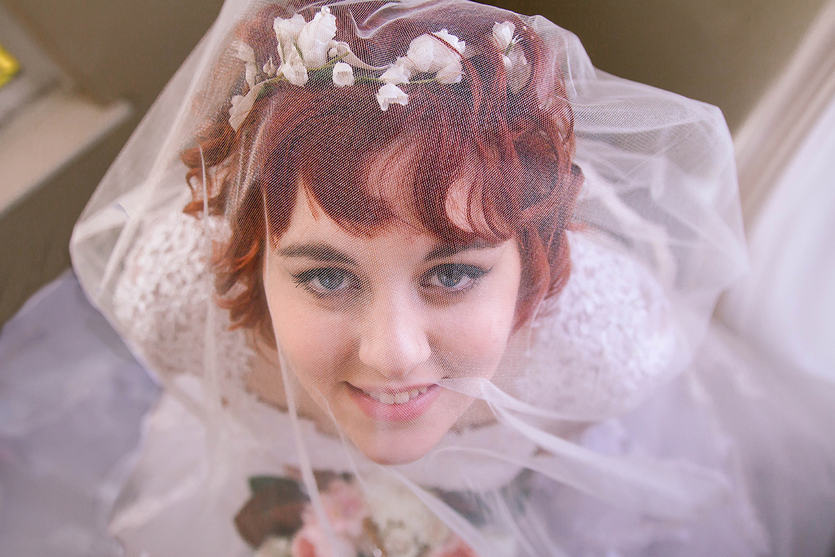 Vintage Bride looking up thru veil.jpg