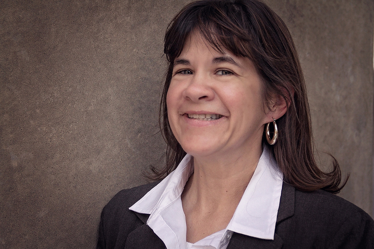 Woman in Brown business suit smiling.jpg