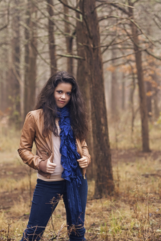 Senior Girl wearing leather jacket in the forest.jpg