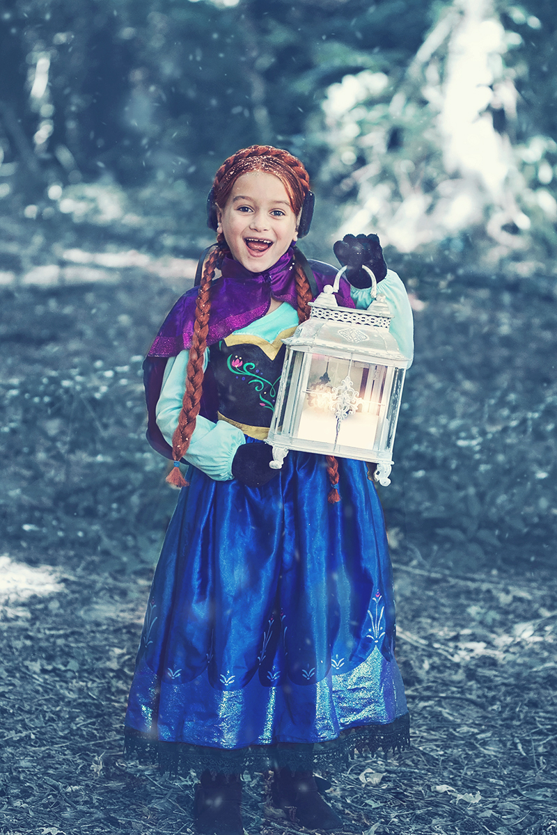 Frozen Themed Anna in forest with a light.jpg