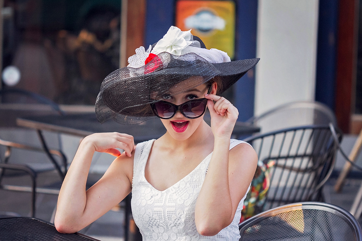 Audrey Hepburn styled session  girl pearing over sunglasses.jpg