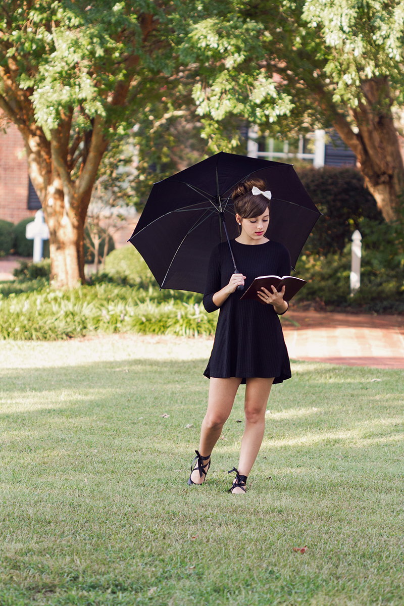 Audrey Hepburn styled session  girl reading book under umbrella.jpg