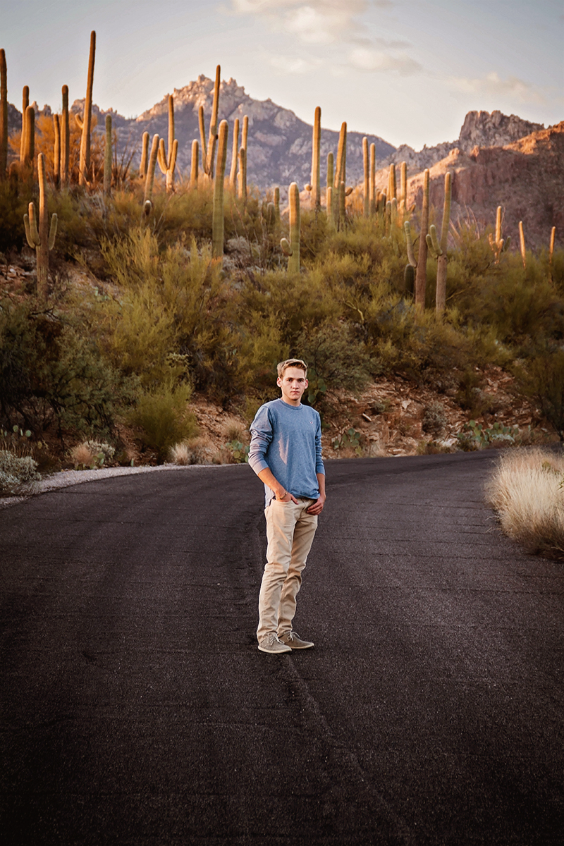 Arizona Senior Guy standing along a cactus lined road.jpg