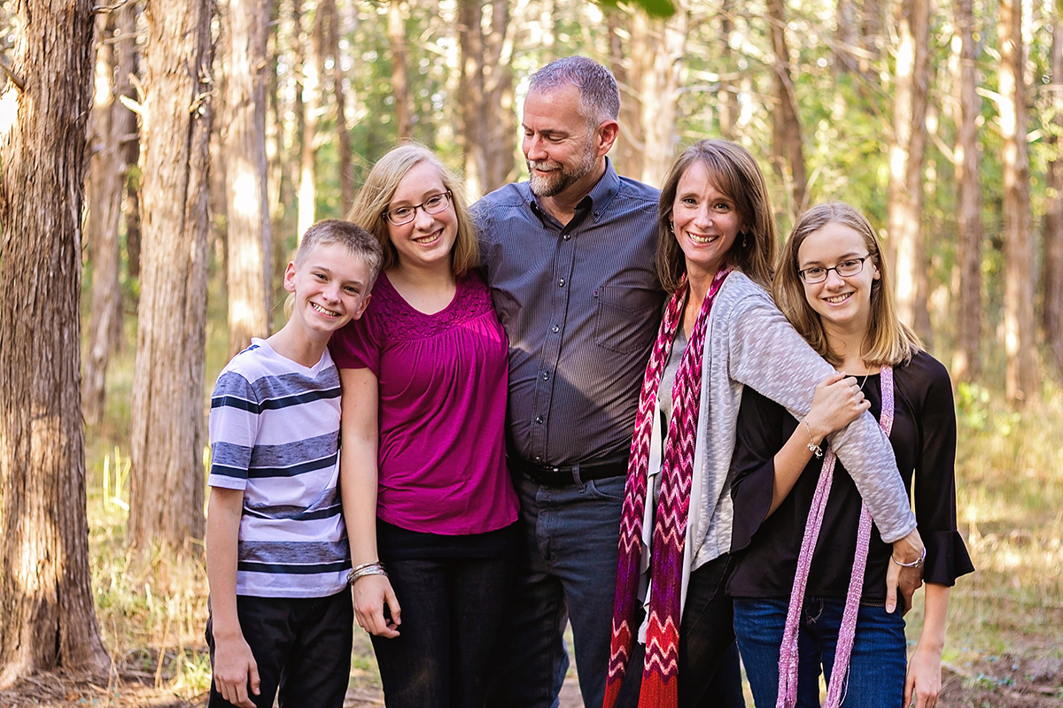 Portrait of Family holding one another in pink.jpg