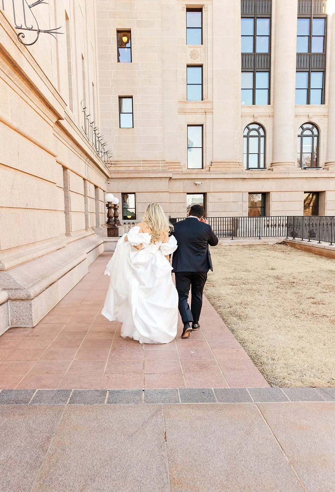 Bride and Groom walking to the  captiol JSP Photography.jpg