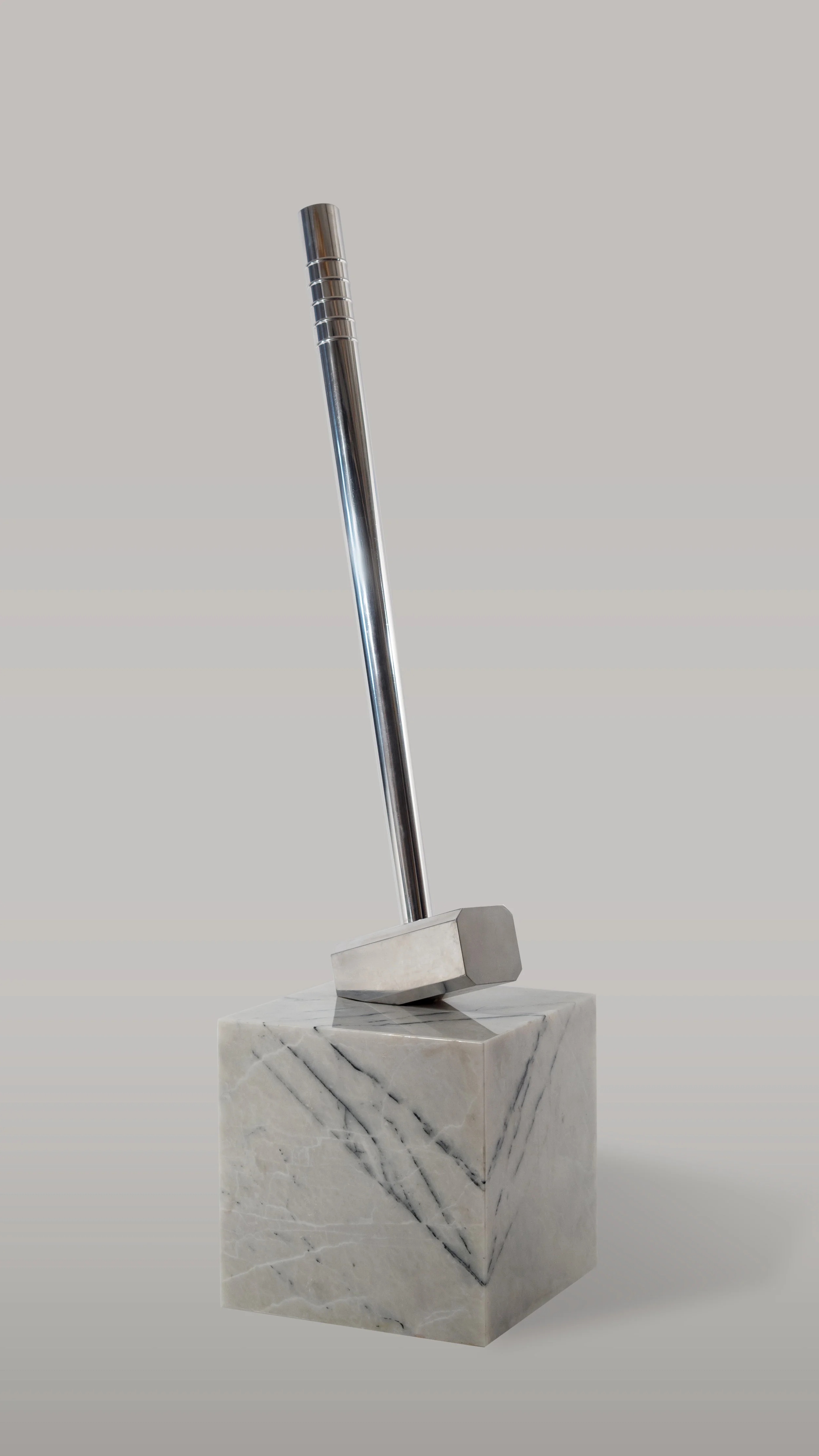 Aluminum Sledgehammer in Marble Cube, 2017. Ahmet Civelek