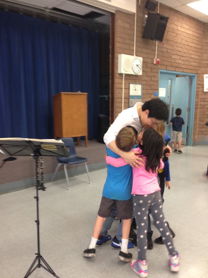 Music JuiceBox Series artist gets a hug from first graders