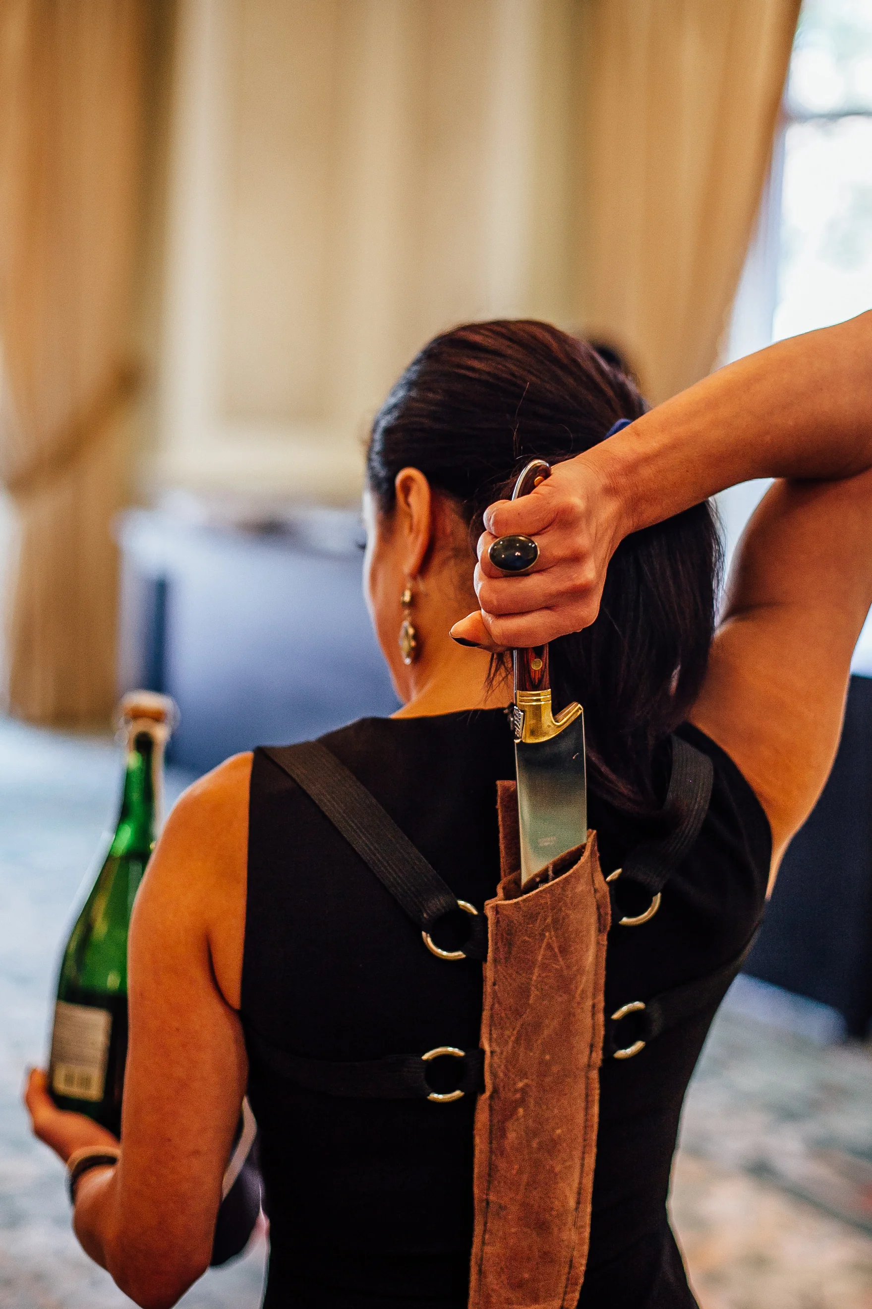 Sommelier Kat Thomas with saber.jpg