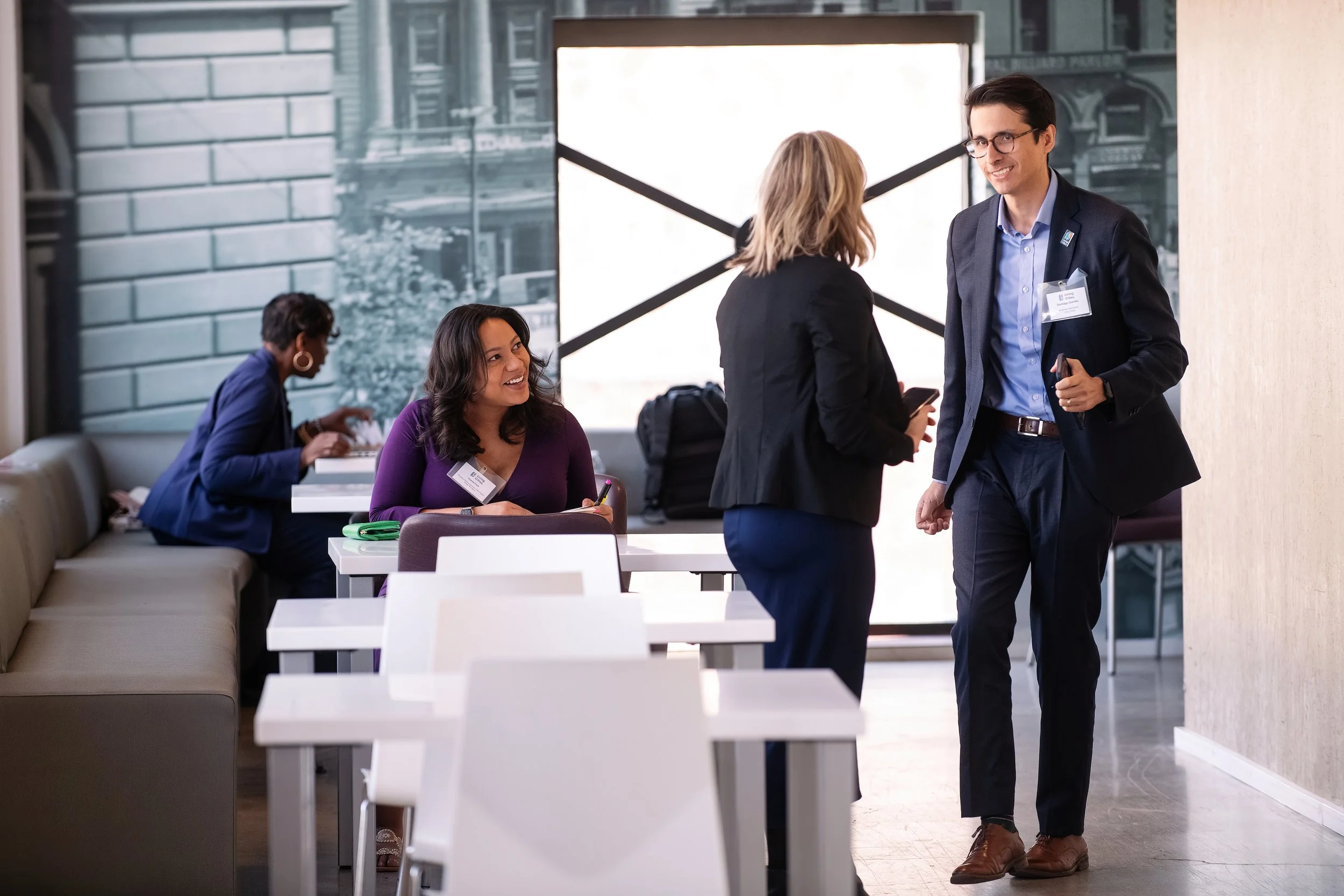   Detroit-based corporate event photography capturing professionals in conversation.  