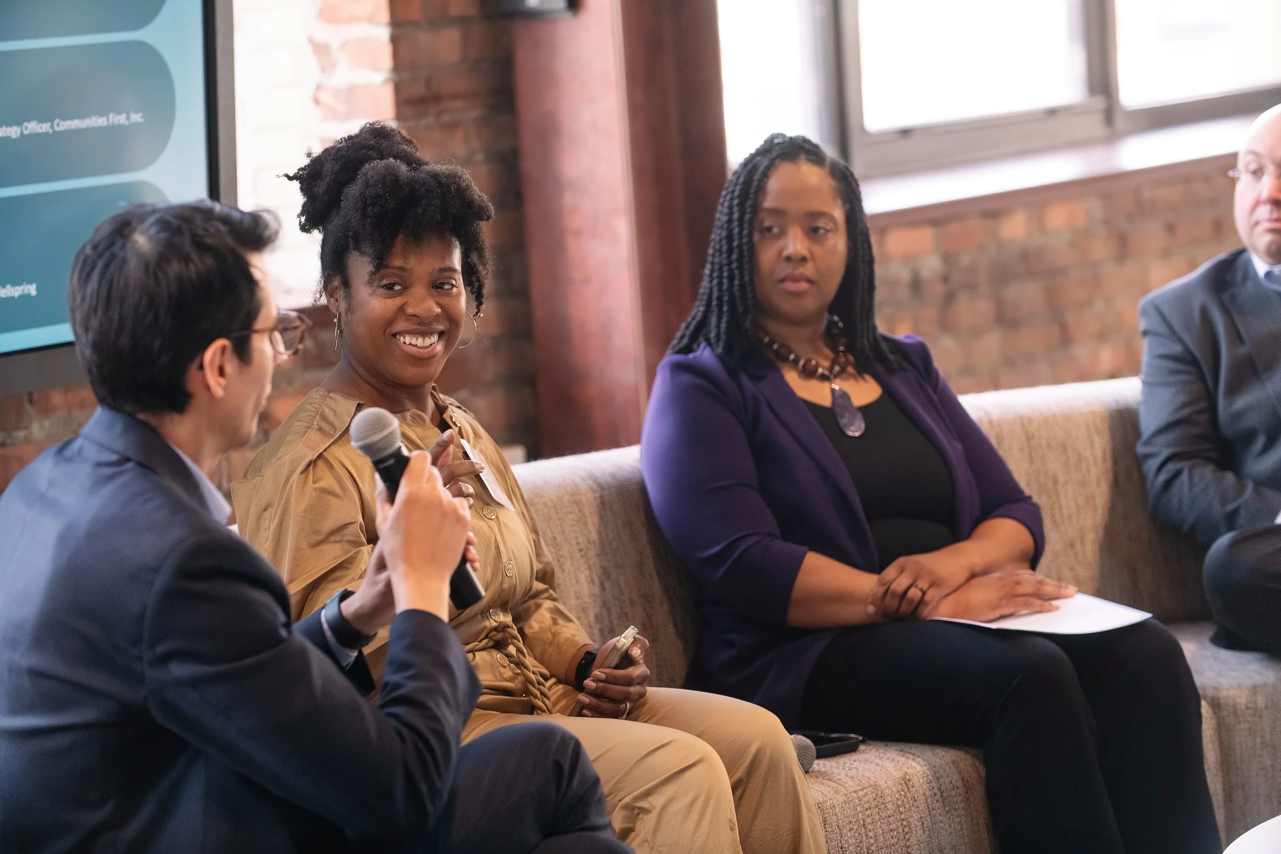   Detroit corporate event photography showing speakers and audience interaction.  