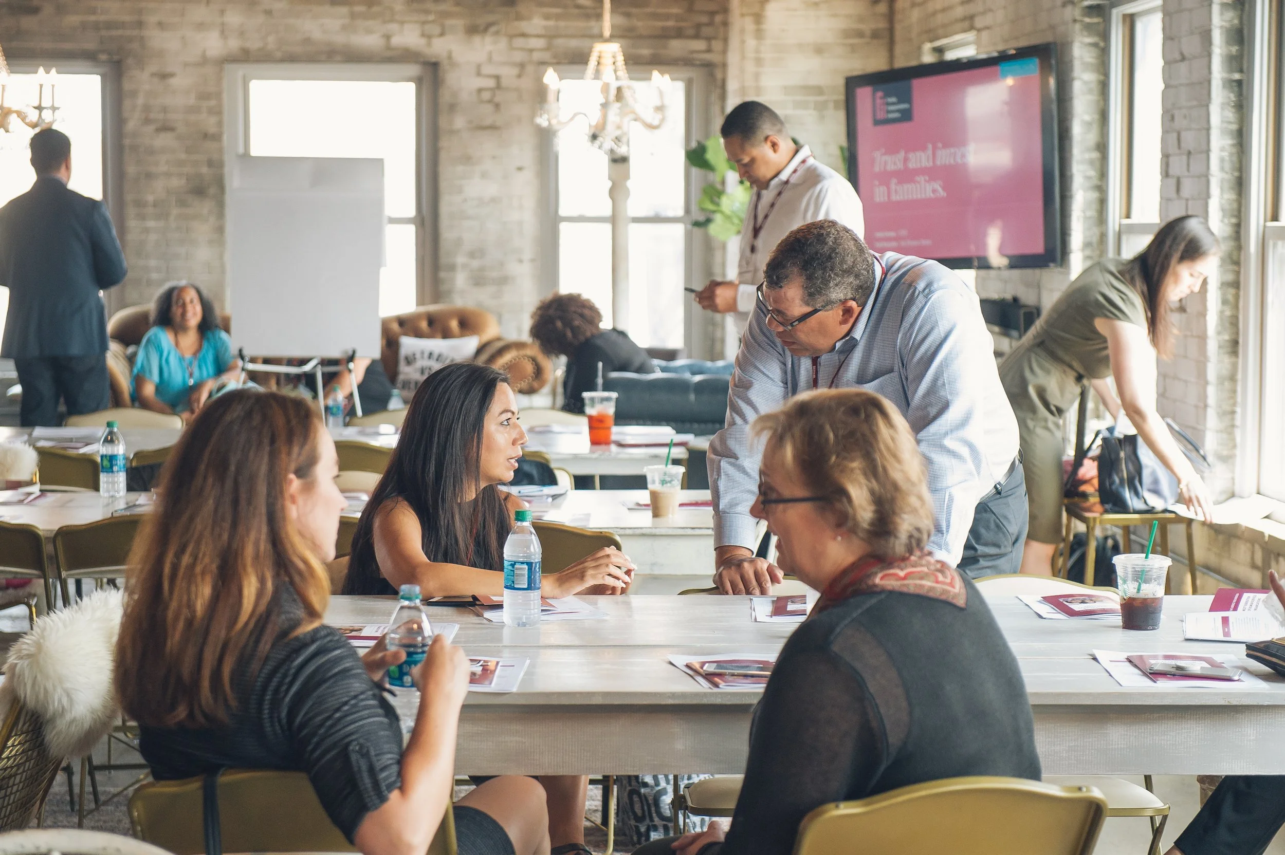   Business event in Detroit documented with a focus on people and interaction.  