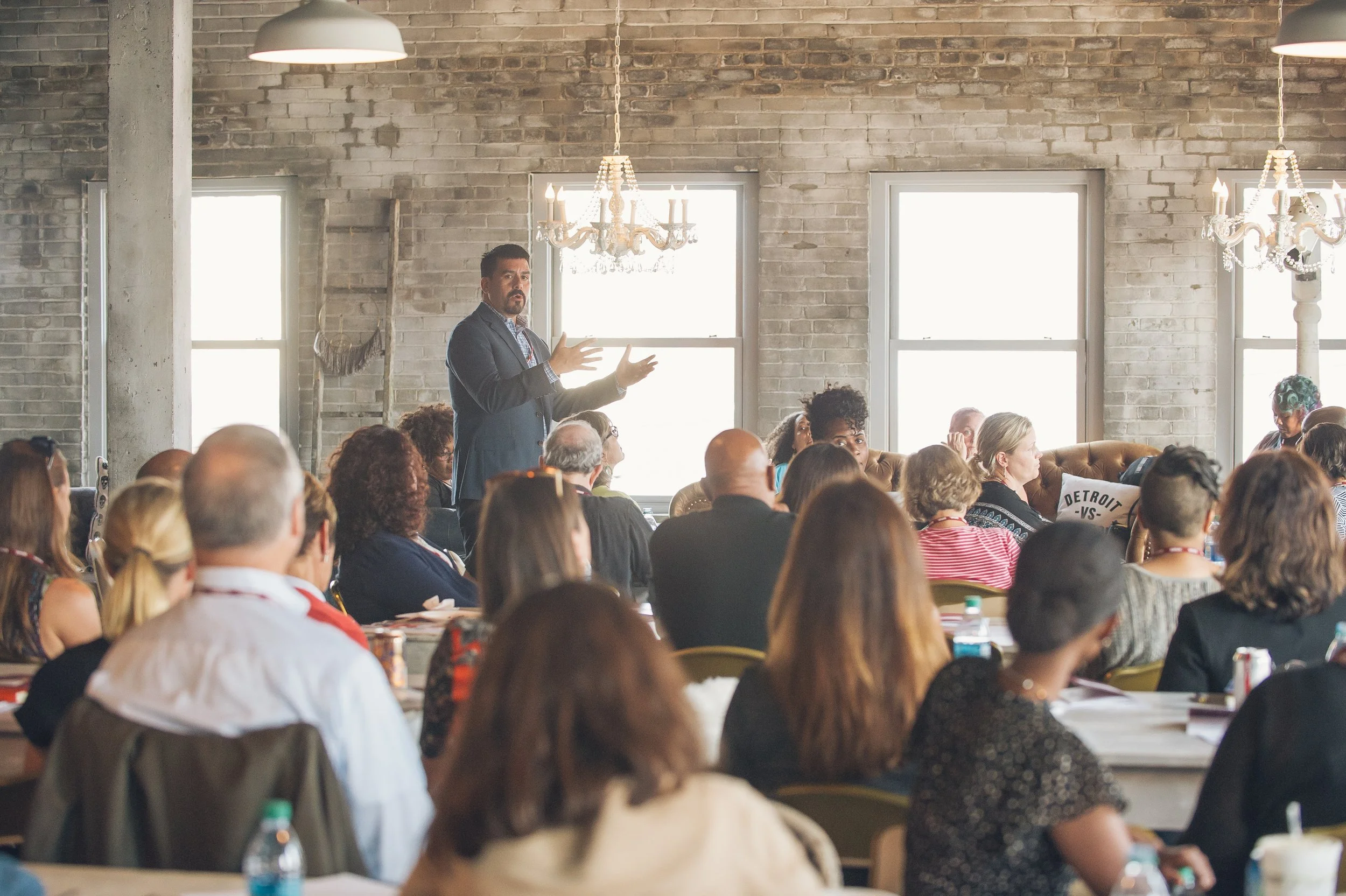   Detroit-based corporate event photography showing candid moments during a conference.  
