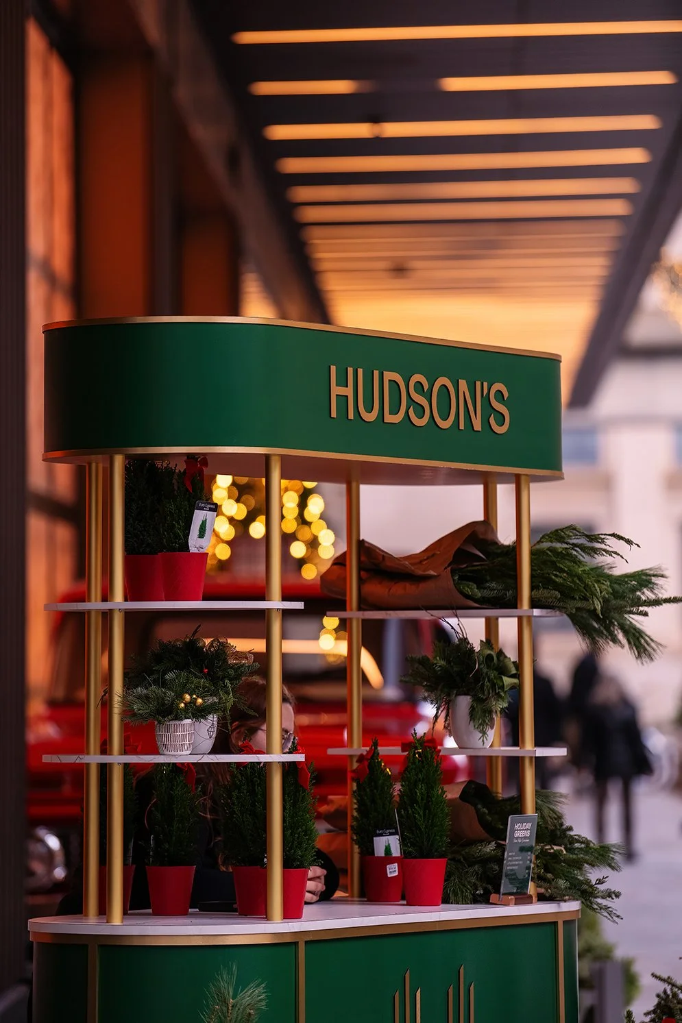   Families walking through the Nick Gilbert Way holiday installation at Hudson’s Detroit in Detroit, developed by Bedrock.  