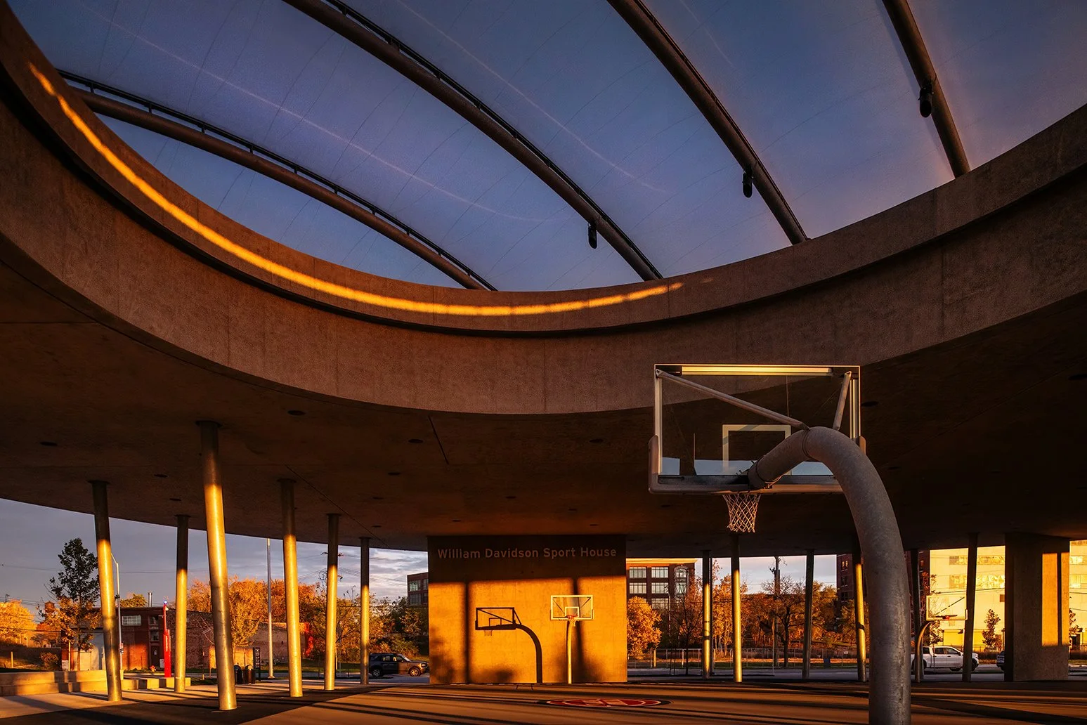 Upward view of the canopy and skylight at the William Davidson Sport House in Detroit, emphasizing architectural details by Adjaye Associates.