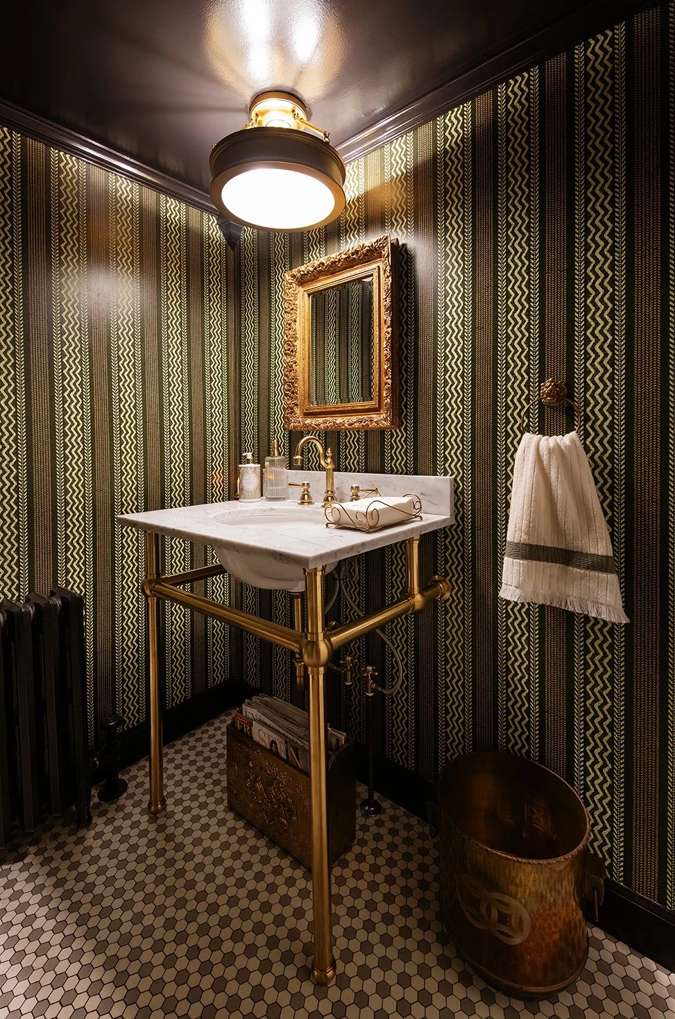 Architectural and interior residential photograph taken of The Gratz Life for HGTV. This image shows the under stairs bathroom.