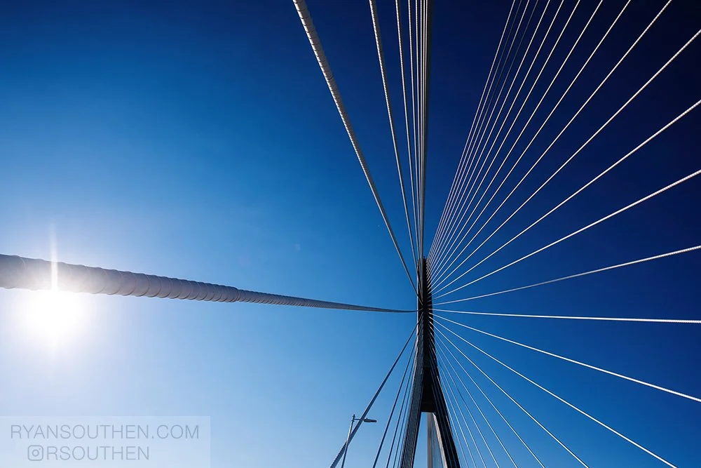 Opening-day view of pedestrians walking across the Gordie Howe International Bridge from Detroit to Windsor.