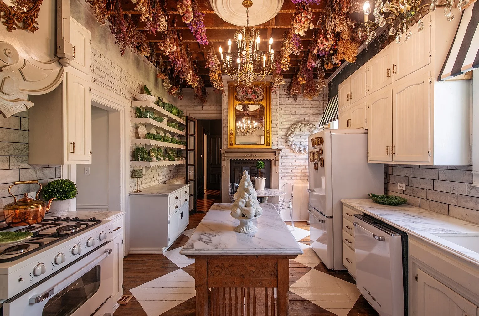 Architectural and interior residential photograph taken of the Iron Victorian for HGTV. This image shows the kitchen looking towards the dining area.