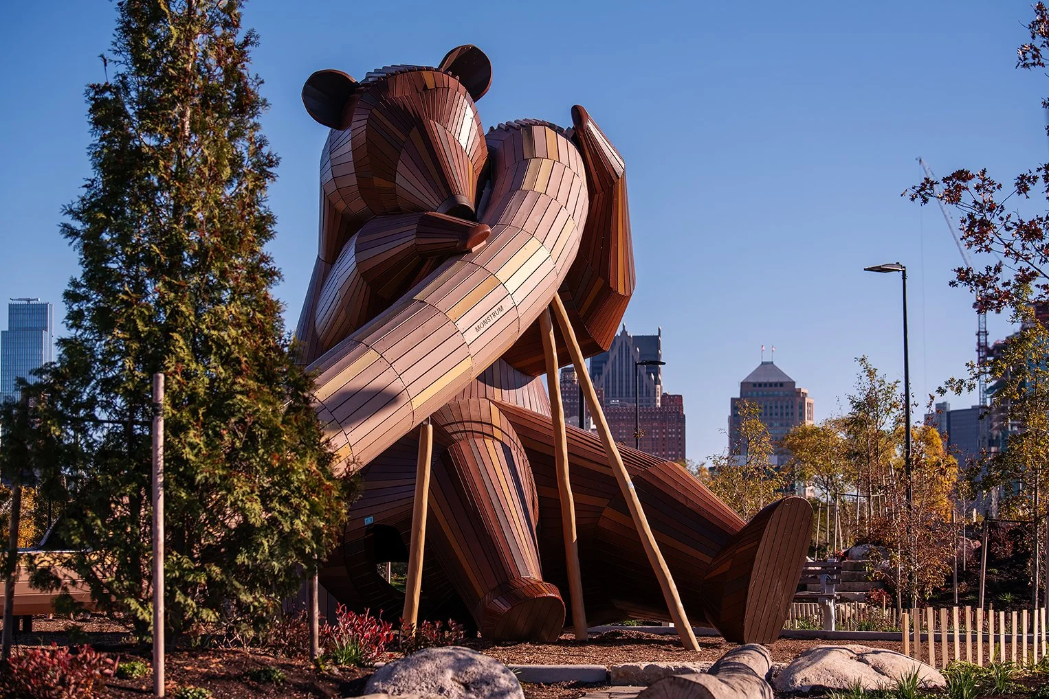 Riverfront landscape at Ralph C. Wilson Jr. Park in Detroit, showing naturalized planting and circulation planned by the Detroit Riverfront Conservancy and MVVA.