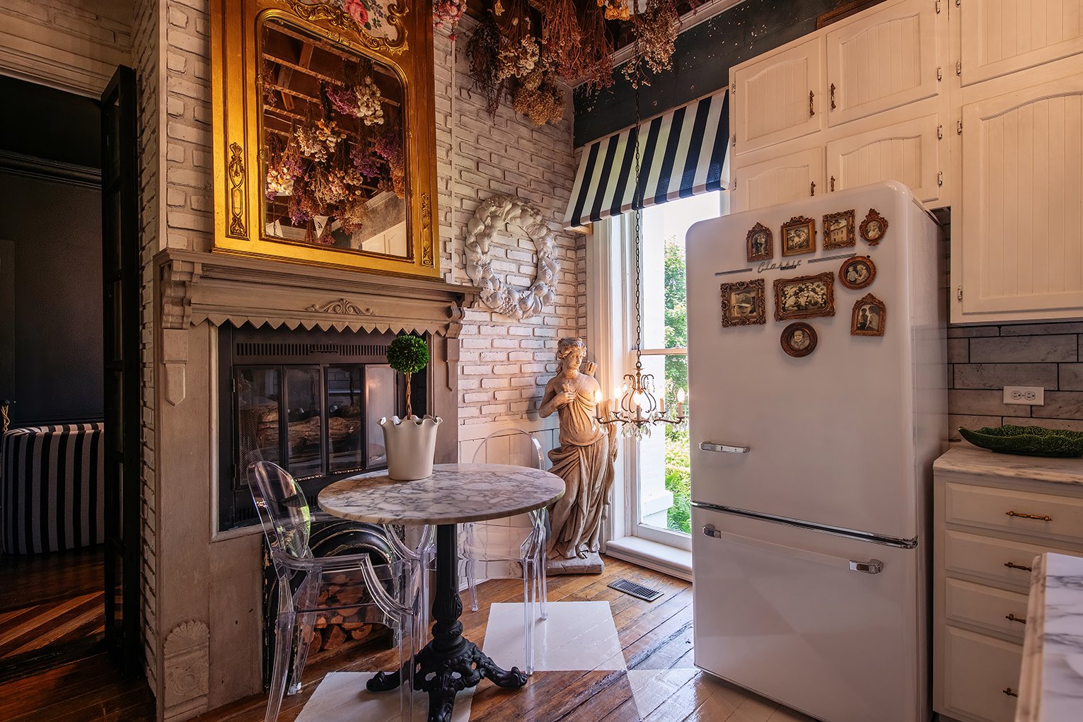 Architectural and interior residential photograph taken of the Iron Victorian for HGTV. This image shows the breakfast nook in the kitchen.