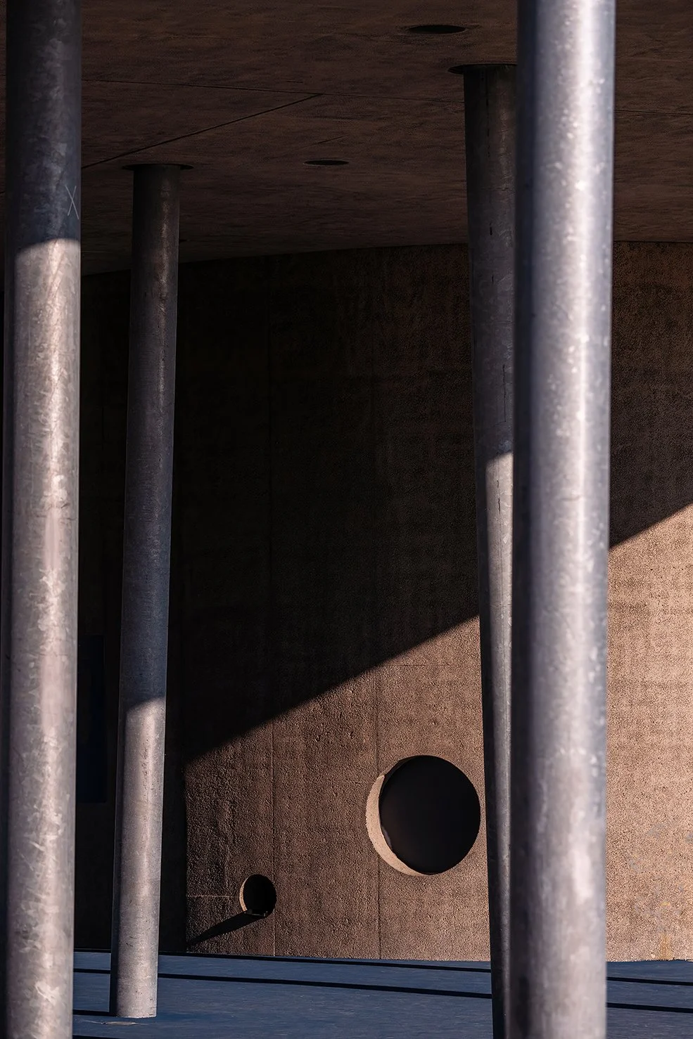 Evening exterior of the William Davidson Sport House in Detroit, with the canopy illuminated as designed by Adjaye Associates.