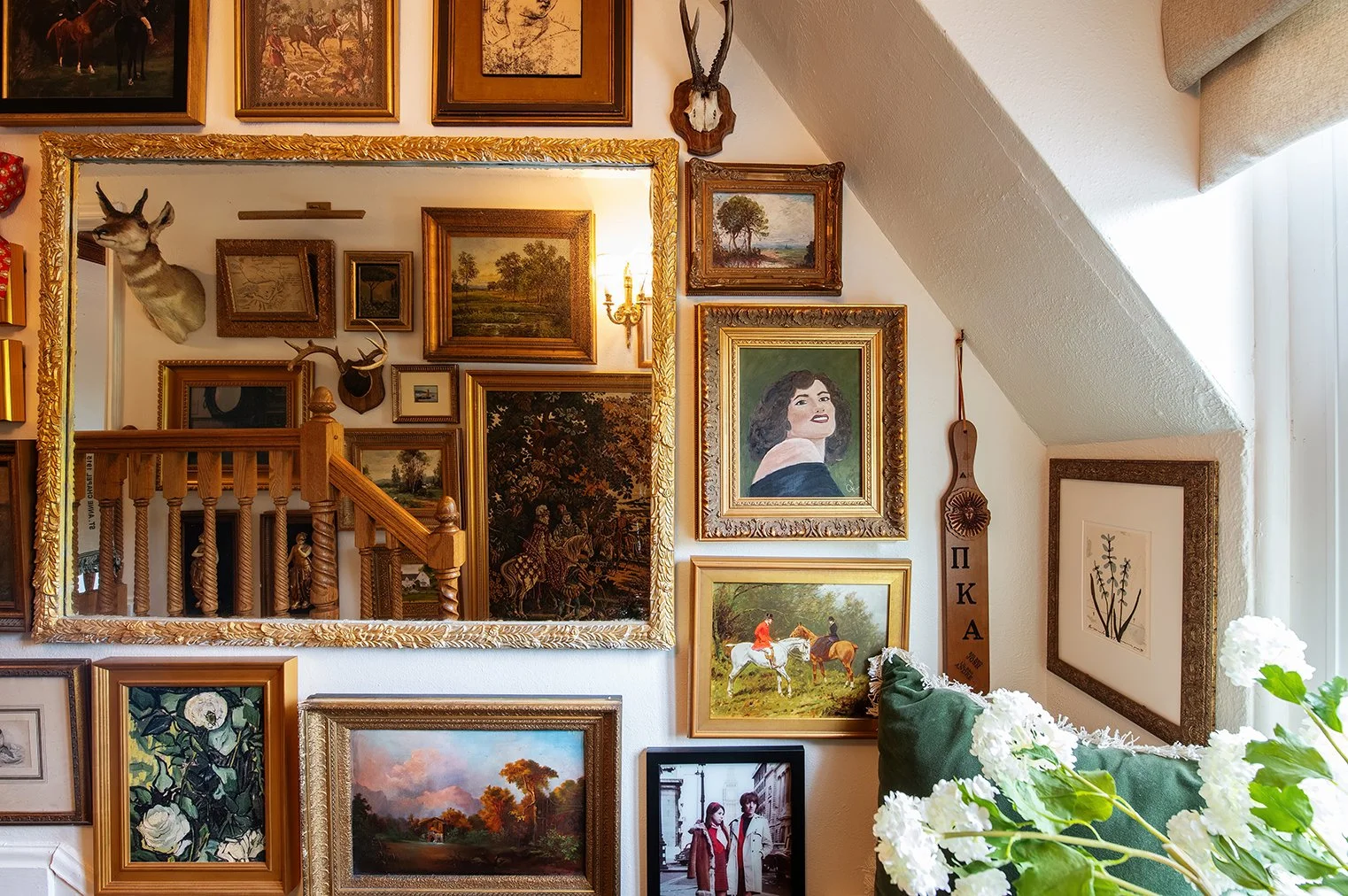 Architectural and interior residential photograph taken of The Gratz Life for HGTV. This image shows the gallery wall in the stairwell.