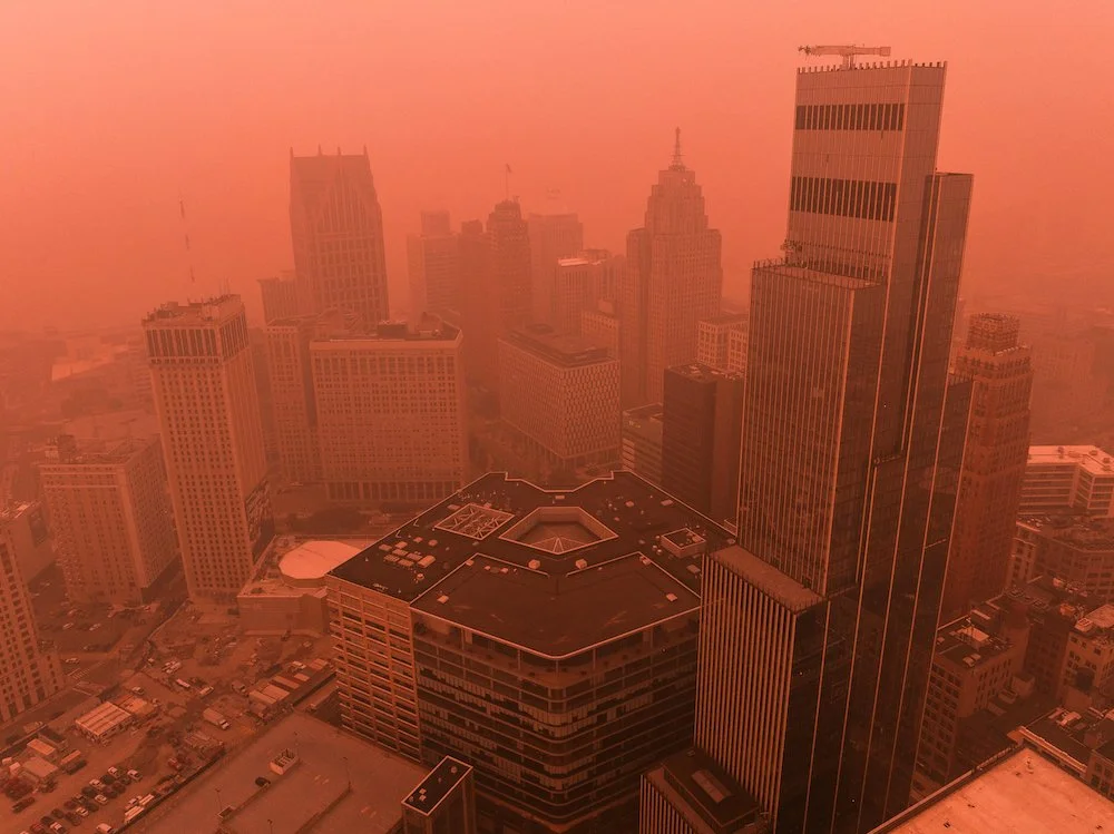Drone image of downtown Detroit highlighting the city's architecture during a period of regional wildfire smoke.