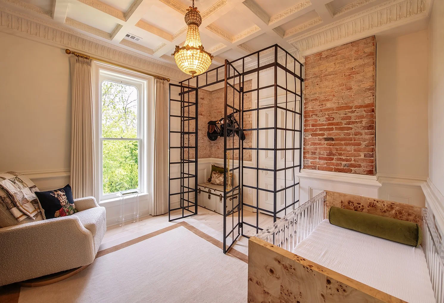 Architectural and interior residential photograph taken of the Iron Victorian for HGTV. This image shows the young baby's bedroom and crib.
