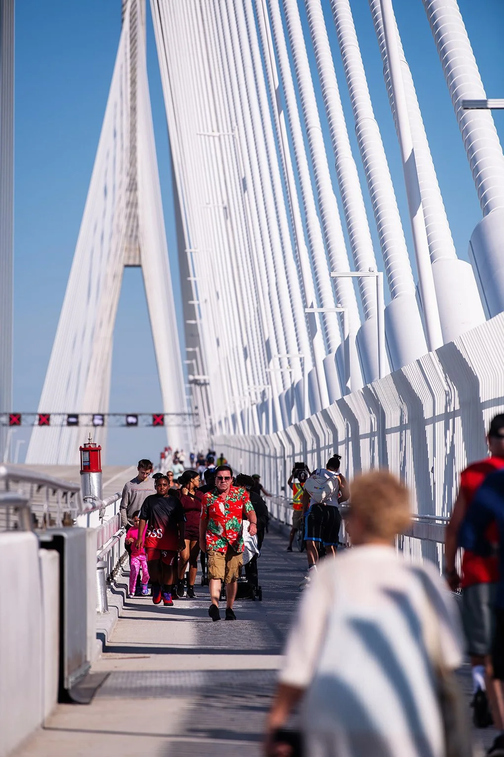 Architectural view of the Gordie Howe International Bridge filled with pedestrians during the Detroit-to-Windsor opening.