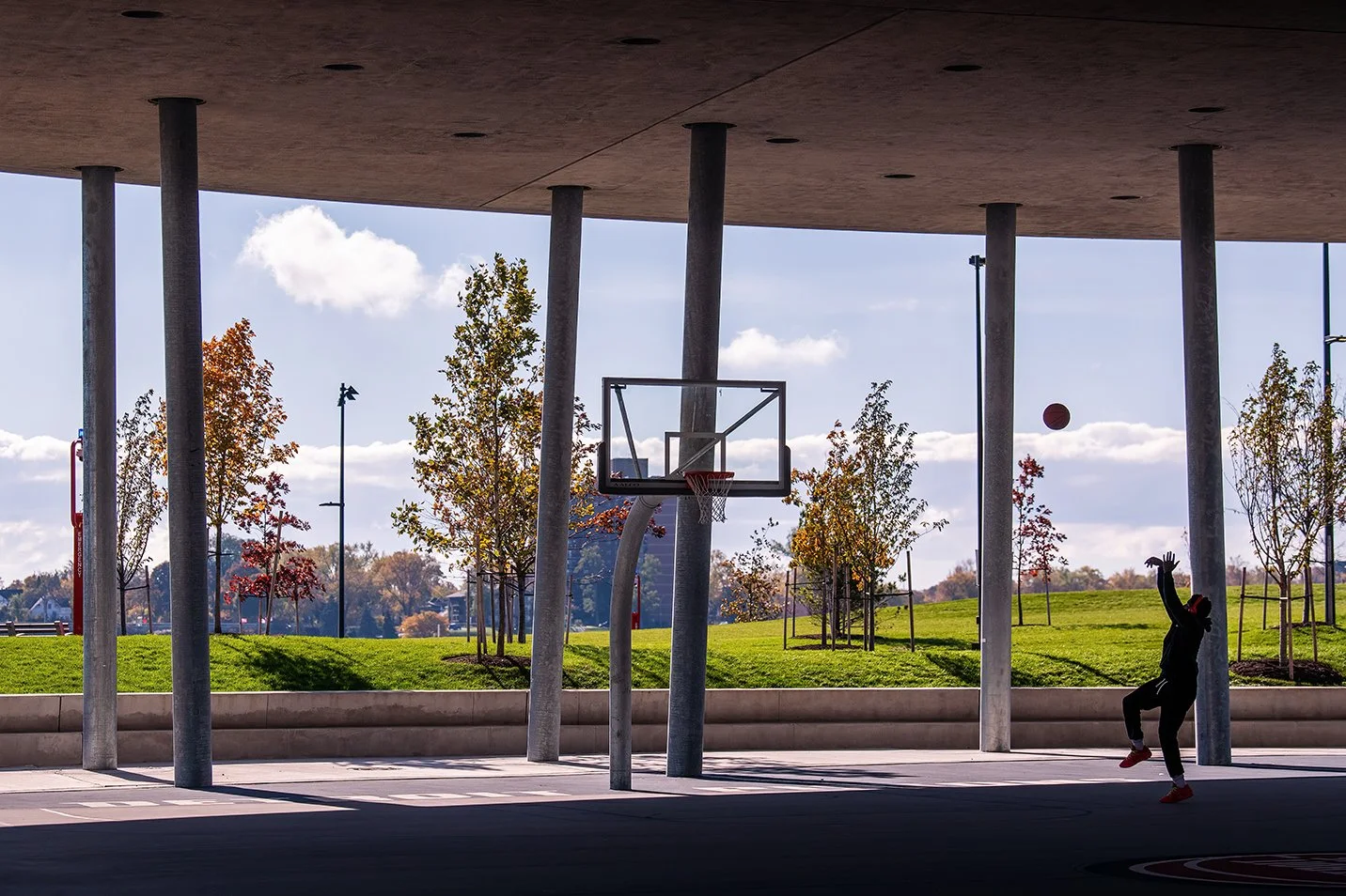 Contextual view of the William Davidson Sport House within Ralph C. Wilson Jr. Park in Detroit, showing its placement and design by Adjaye Associates.