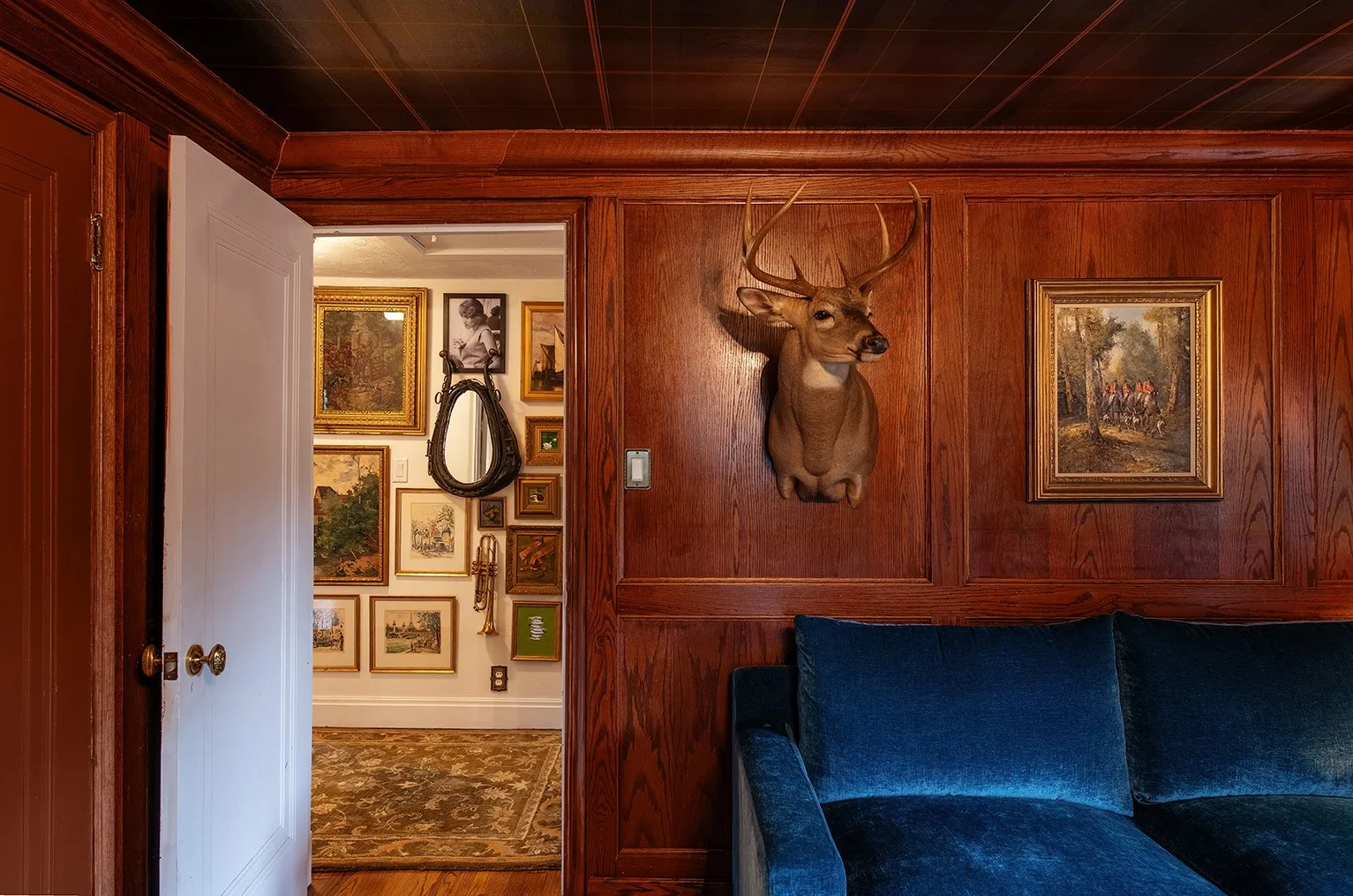 Architectural and interior residential photograph taken of The Gratz Life for HGTV. This image shows the seating area of the office looking into the hall.