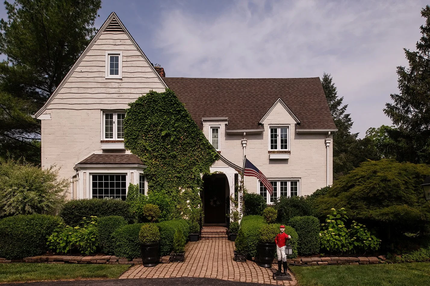 Architectural and interior residential photograph taken of The Gratz Life for HGTV. This image shows the exterior of the 1926 tudor home.