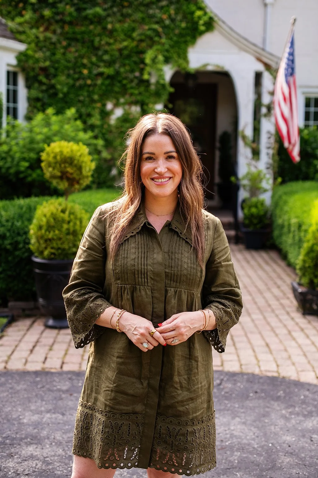 Set against the exterior of a historic Tudor home in Michigan, this owner’s portrait reflects the heart, history, and everyday beauty of The Gratz Life.