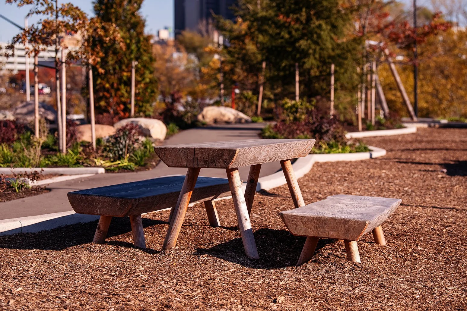 View of pathways and seating areas at Ralph C. Wilson Jr. Park in Detroit, developed by the Detroit Riverfront Conservancy with landscape architecture by MVVA.