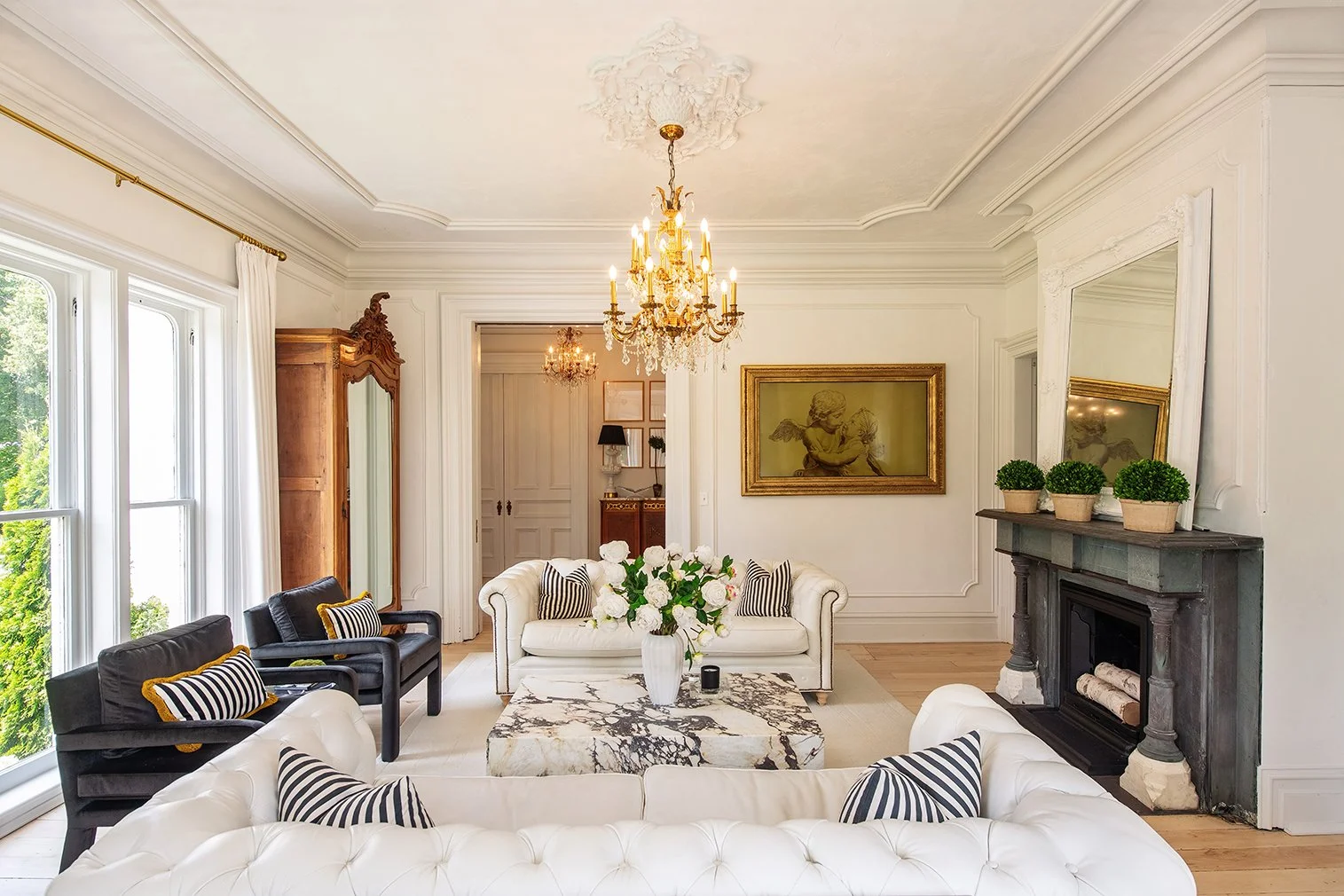 Architectural and interior residential photograph taken of the Iron Victorian for HGTV. This image shows the living room looking back towards the entryway.