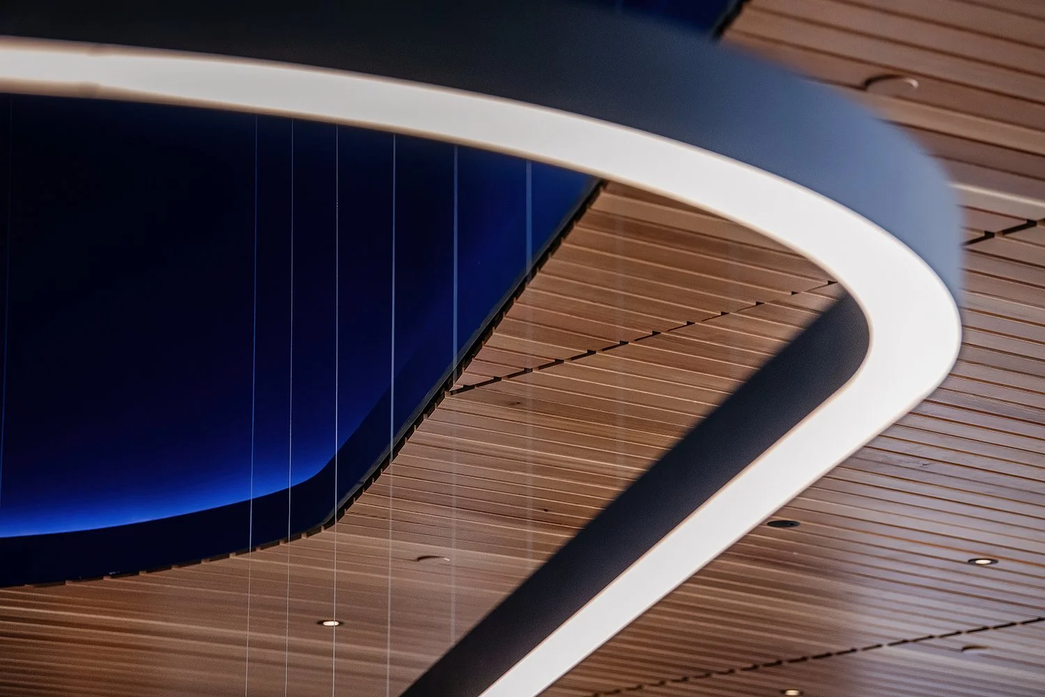 Wide interior view emphasizing spatial flow and natural light inside the Ford World Headquarters, designed by Snøhetta.