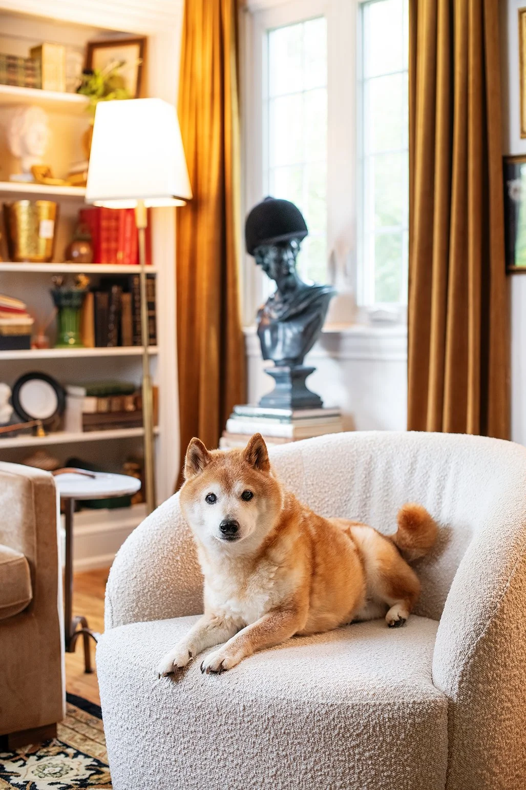 Neutral tones and collected textures highlight the enduring charm of a historic Tudor interior in Michigan, thoughtfully curated by The Gratz Life.