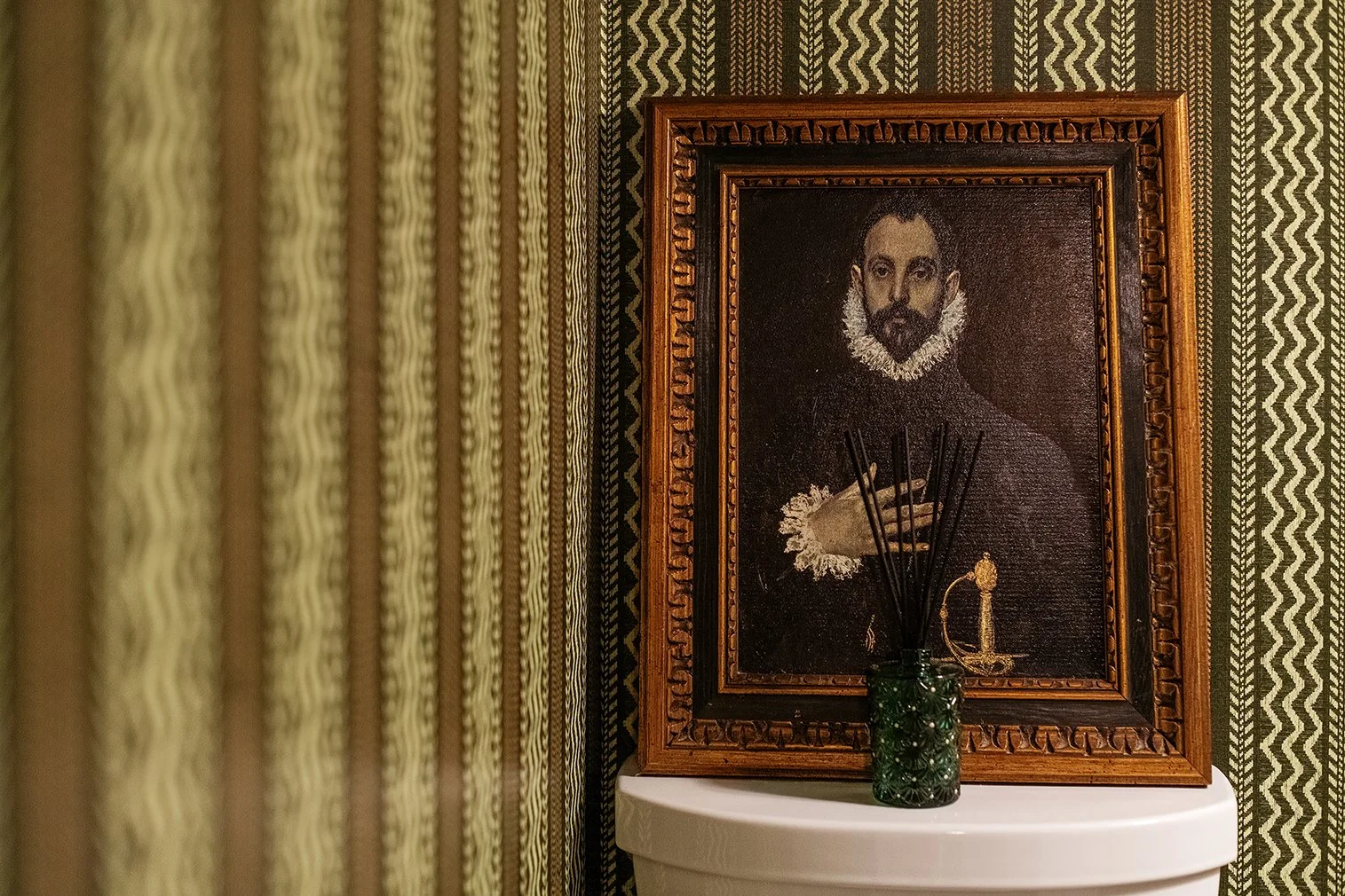 Subtle details and a sense of age give this Tudor powder room its presence, proving that even the smallest spaces can carry history—The Gratz Life way.