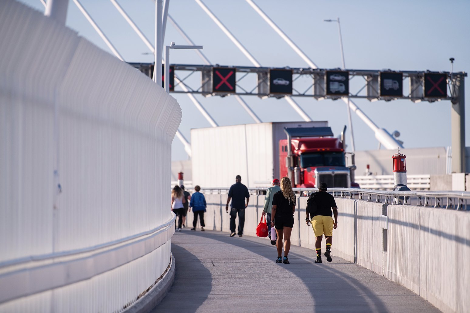 Opening-day pedestrians on the Gordie Howe International Bridge international crossing between Detroit and Windsor.