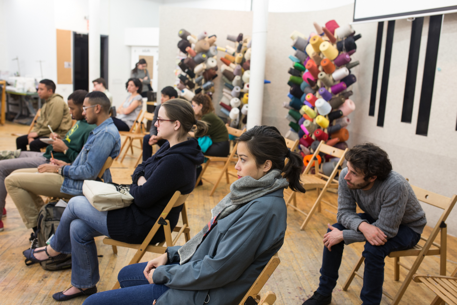 The different group of the audience watches the performance.
