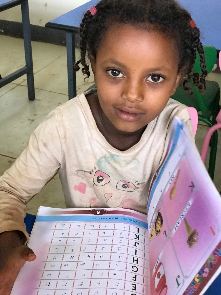 A Degale Children's Library regular smiles for the camera as she learns her ABCs!