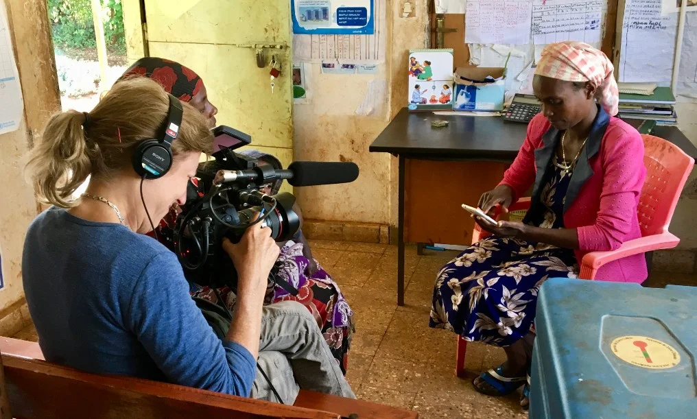 Mary Olive filming WEEMA's mHealth project