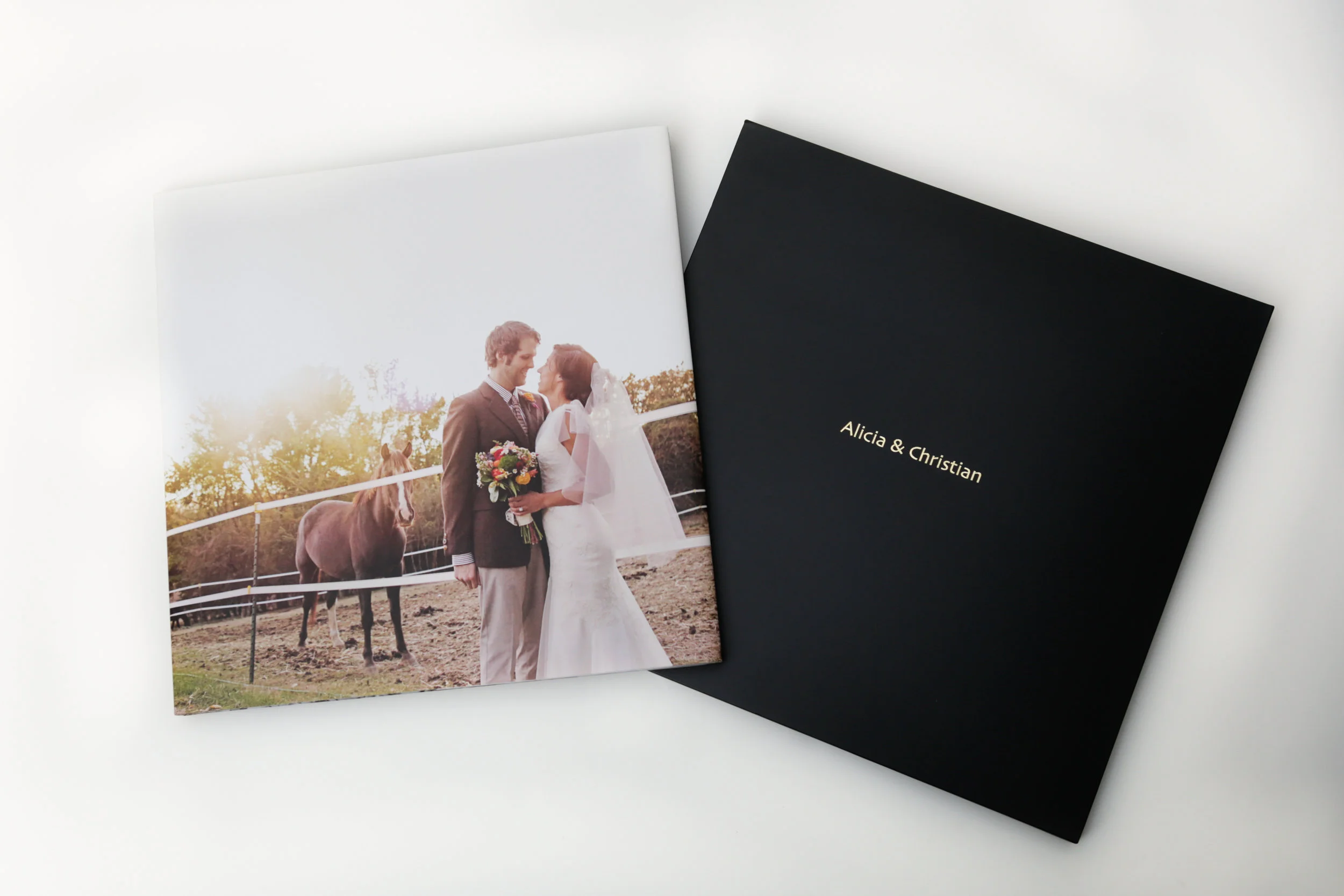 Modern Album BOOK A FULL WEDDING DAY FOR 2017 AND RECEIVE A 10X10, 30 PAGE, MODERN ALBUM! A DESIGNABLE HARDCOVER PROTECTED BY MATCHING BOOK JACKET WITH DESIGNABLE INSIDE FLAPS. MAGAZINE-STYLE PAGES WITH GUTTERLESS LAYFLAT BOOK BINDING. OPTIONS OF BLACK OR RED SLIDE-IN CASE AND PERSONALIZED HOT STAMP. FULL PACKAGE involves - Full-day coverage, portal cards for family and friends to view photos online, online proofing site for family and friend ordering, all images on CD or flash drive with special selection, ENGAGEMENT SESSION INCLUDED $3,000! WEDDING DAY NOT UNTIL 2018? THAT'S OKAY! IF YOU BOOK DURING 2017, YOU STILL QUALIFY! 