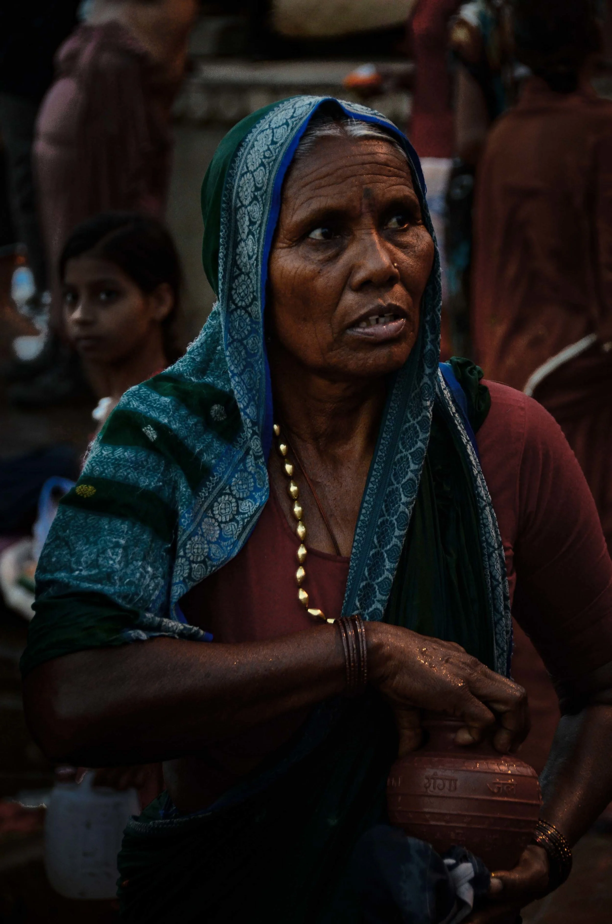 Woman with Urn (preparing to scatter ashes into the Ganges River), Varanasi, India 2012