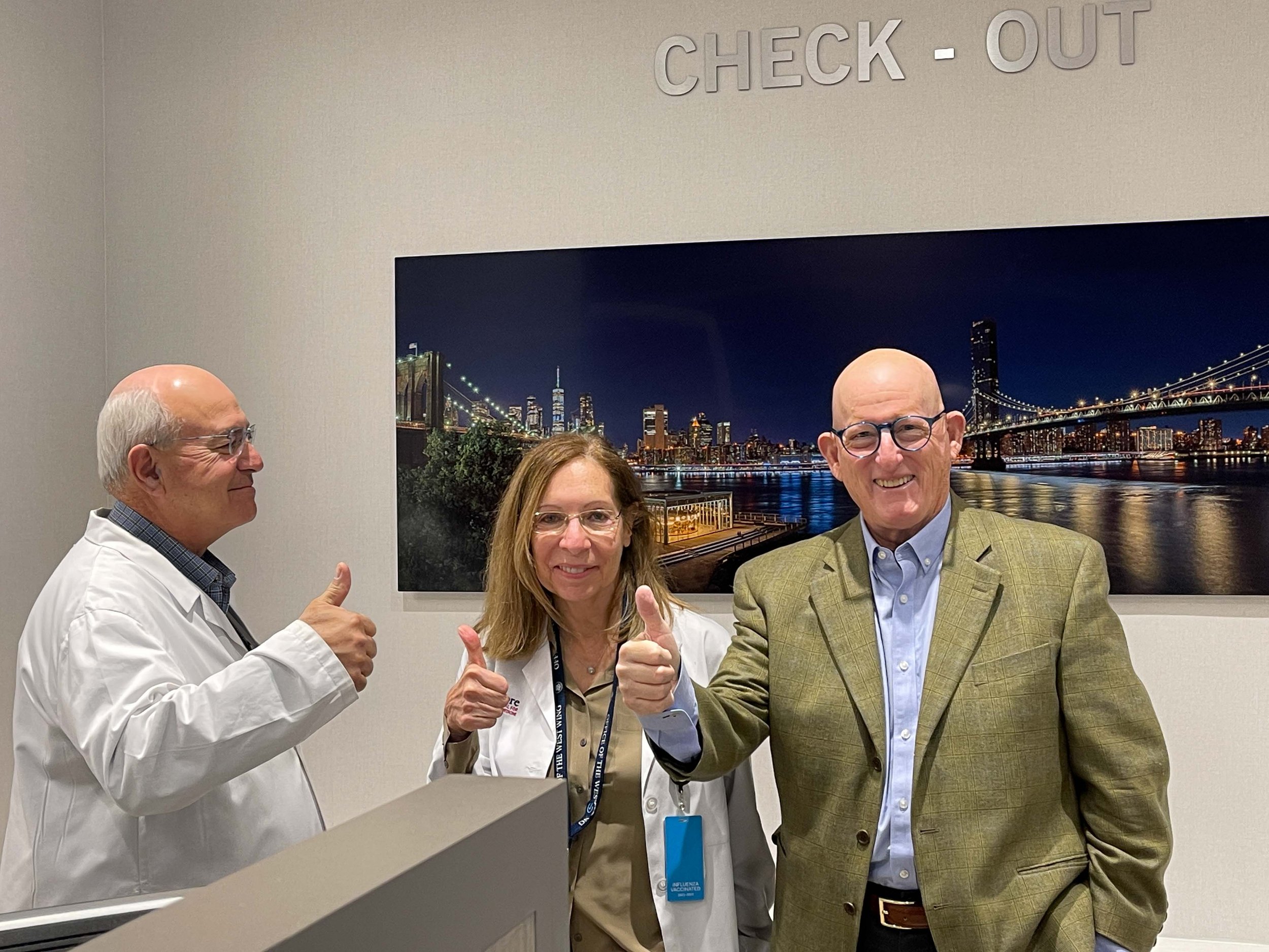 "It's all good." - Neil Cobelli, MD,  Chair, Department of Orthopedic Surgery, Marcie Cobelli, NP, Administrative Director and Dr. Agress with newly donated fine art print. 