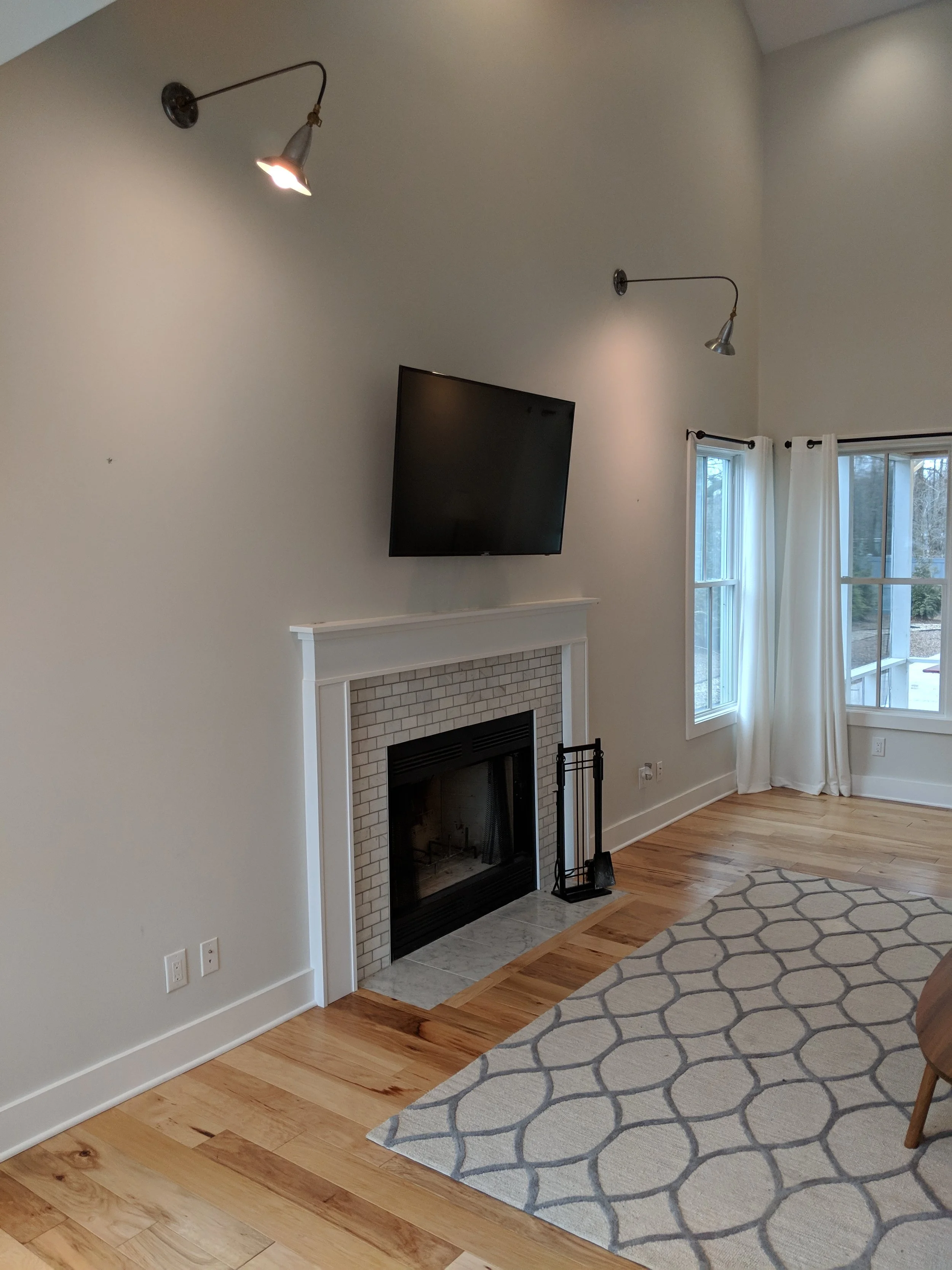 Here’s a before shot of the living room. The blank wall made the fireplace feel so tiny and forgotten!