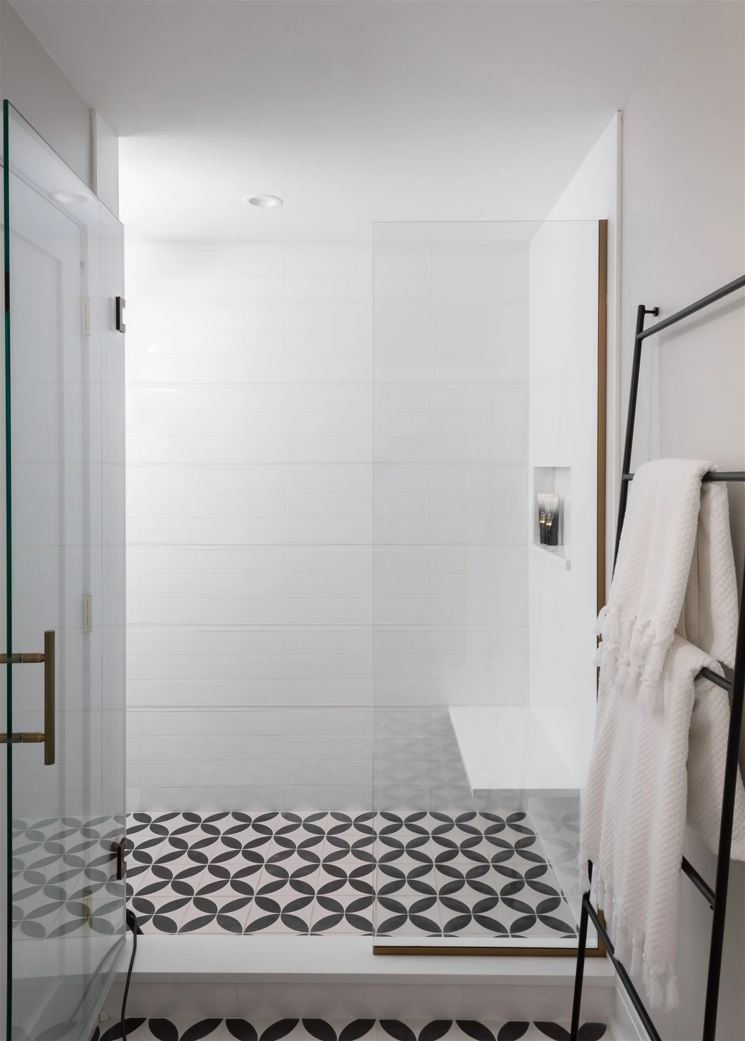 Every three rows, we introduced a white Schluter trim piece to break up the pattern and add some texture.