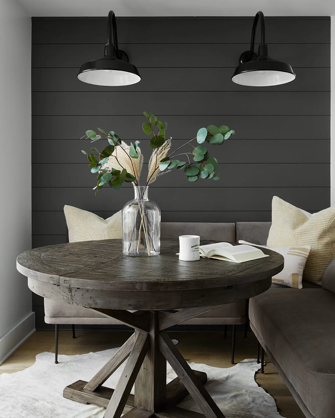 The same charcoal shiplap wall is carried across the back wall of the kitchenette area to add some contrast and keep things cohesive with the other areas.