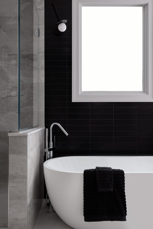 Black and Gray Bathrooms - 15+ Awesome Inspirational Ideas 11 White bathtub contrasted against black tiles.